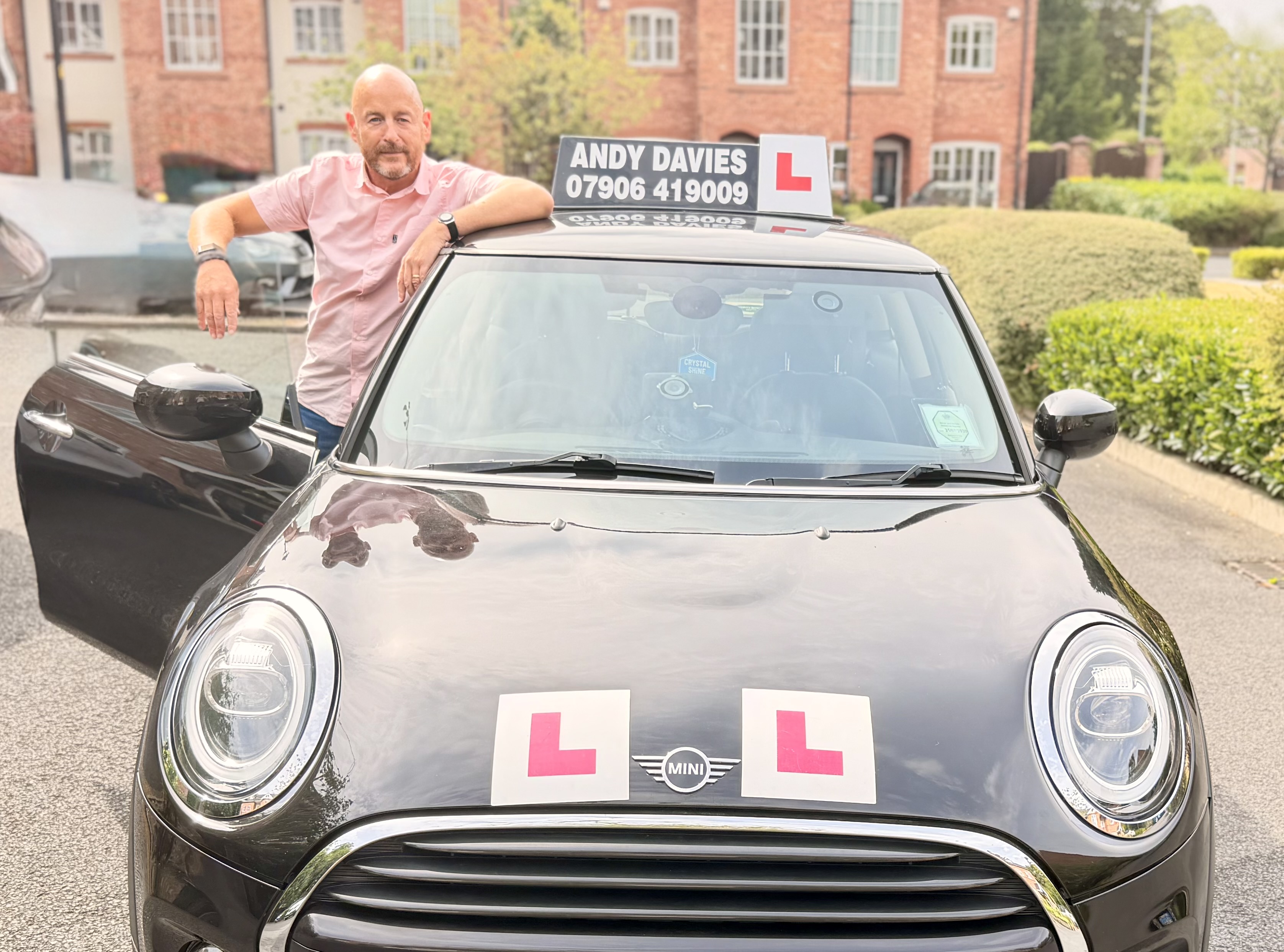 Andy Davies with his Mini driving school car