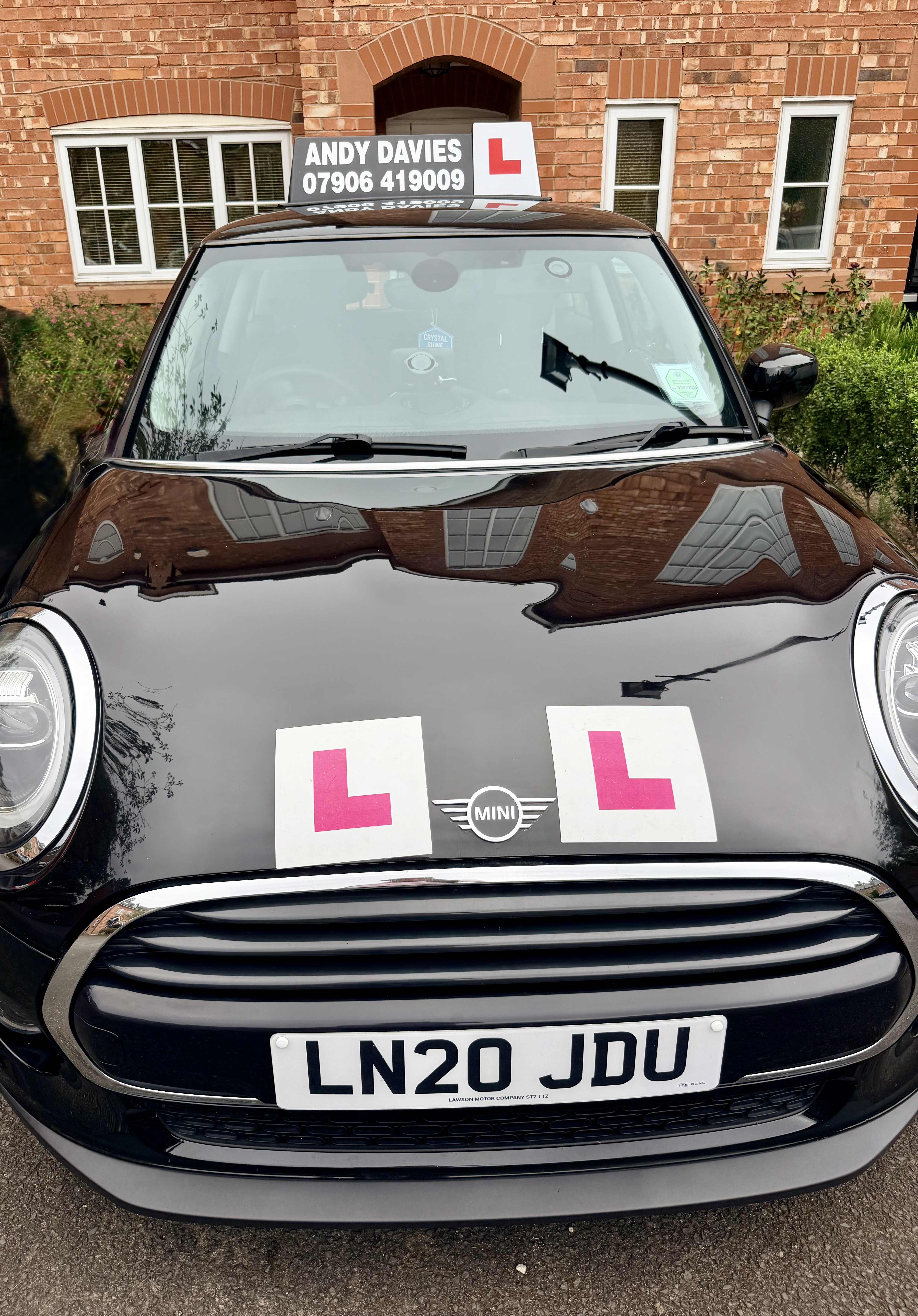 Front view of the Doodles Driving Services Mini
