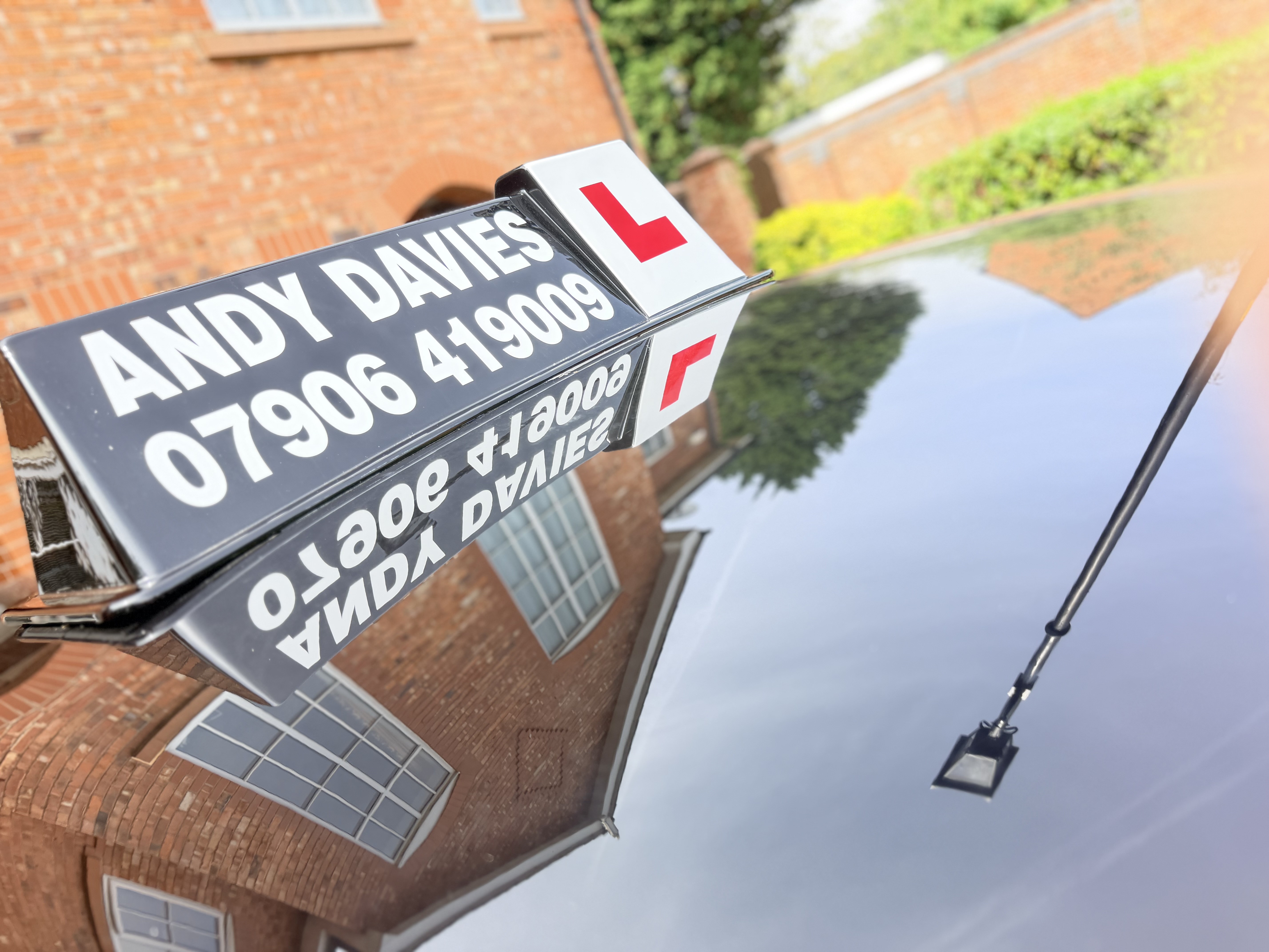 Andy Davies driving-school roof sign